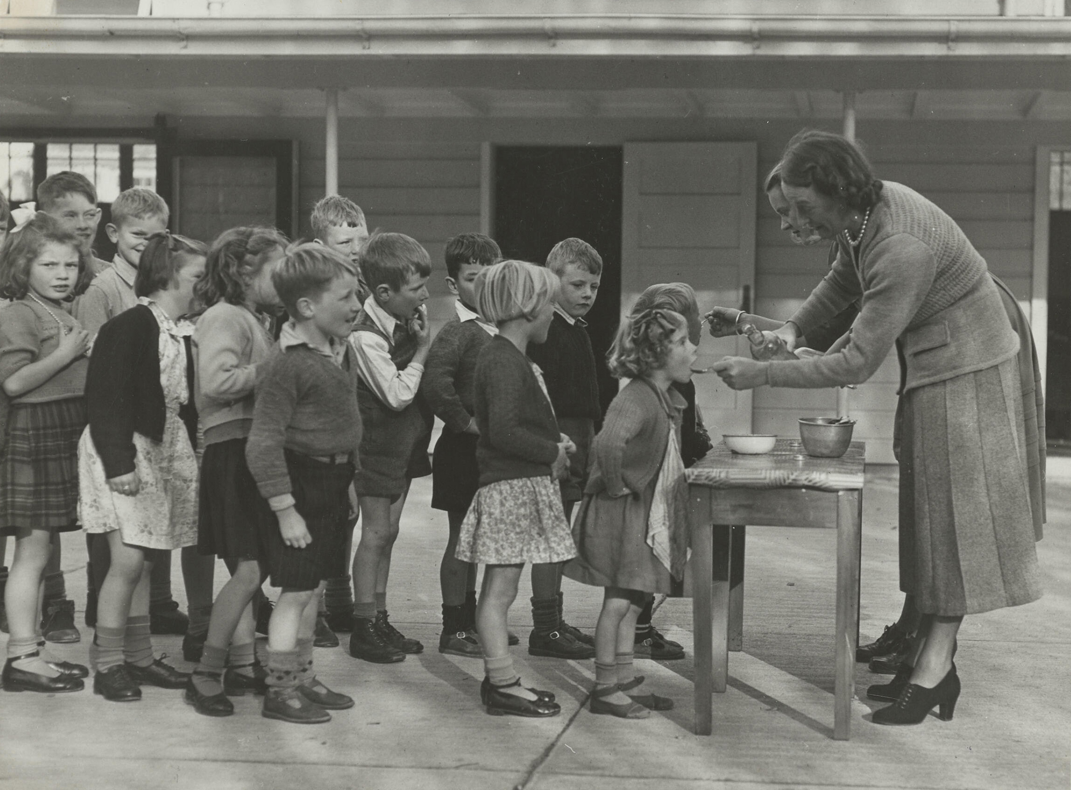 Jack Welsh & Sons, Children taking medicine at Sara Cohen School 