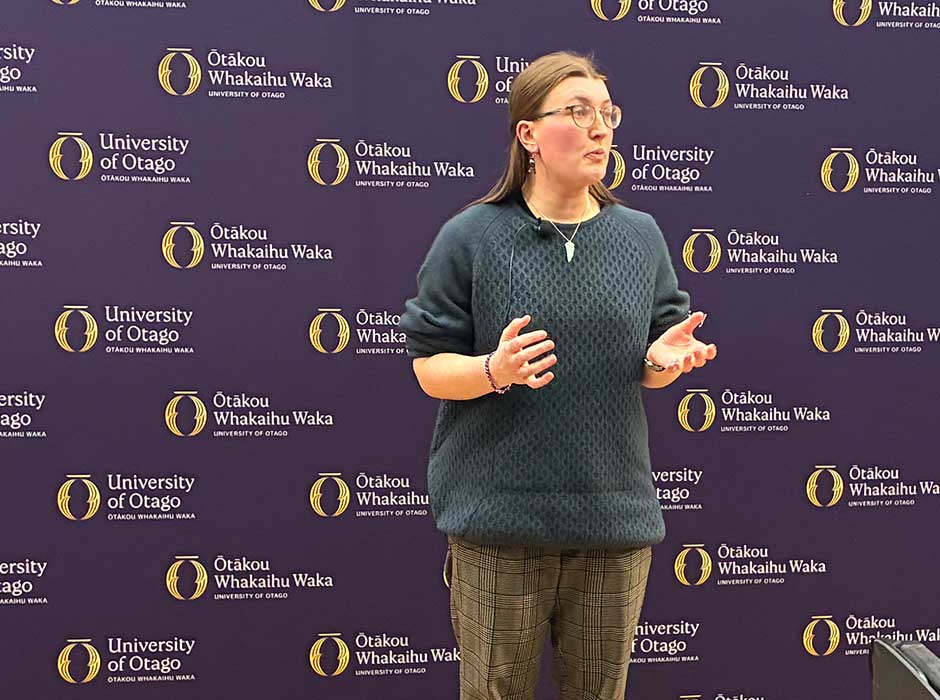 A woman speaking to an audience
