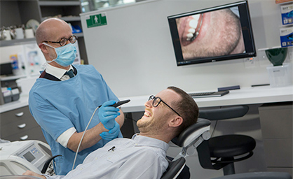 Patient and male dentist
