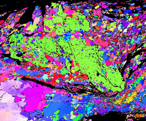 A quartz layer squeezed around a garnet porphyroclast (green) undergoes recrystallisation. Inverse pole figure colouring of an Alpine Fault Zone mylonite, imaged using EBSD in the Zeiss SEM.