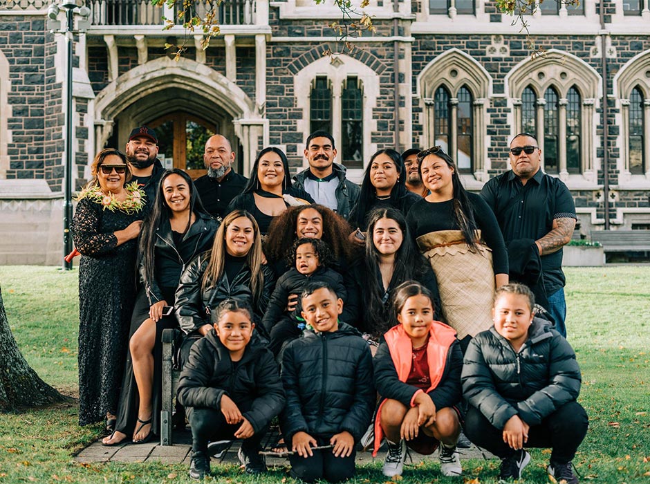 Viena Faiva, centre, was surrounded by her close-knit family when she graduated with a Postgraduate Diploma in Commerce (PGDipCom) in 2022. 