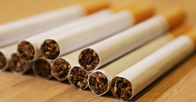 a pack of cigarettes on its side with some sticking out