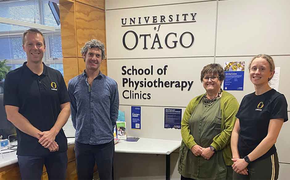 Four people standing in the physio foyer