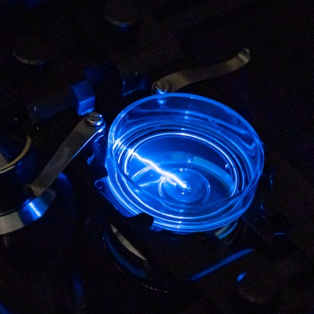 Confocal microscope showing light beam and blue lens