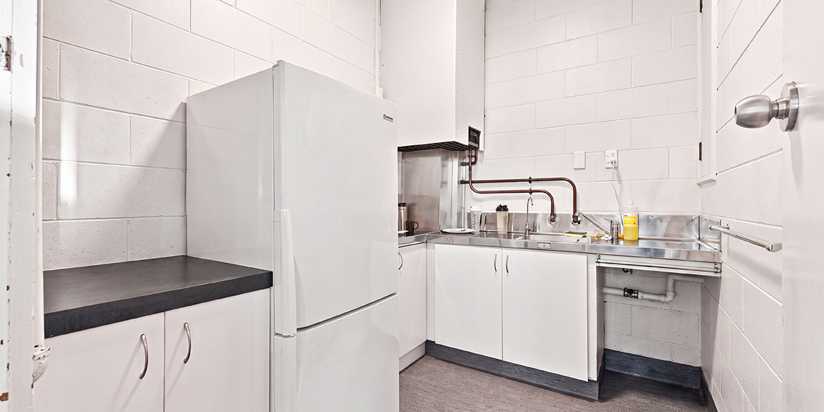 Kitchenette with fridge and sink
