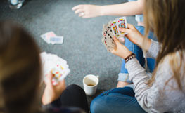 University of Otago students playing a card game. Image.