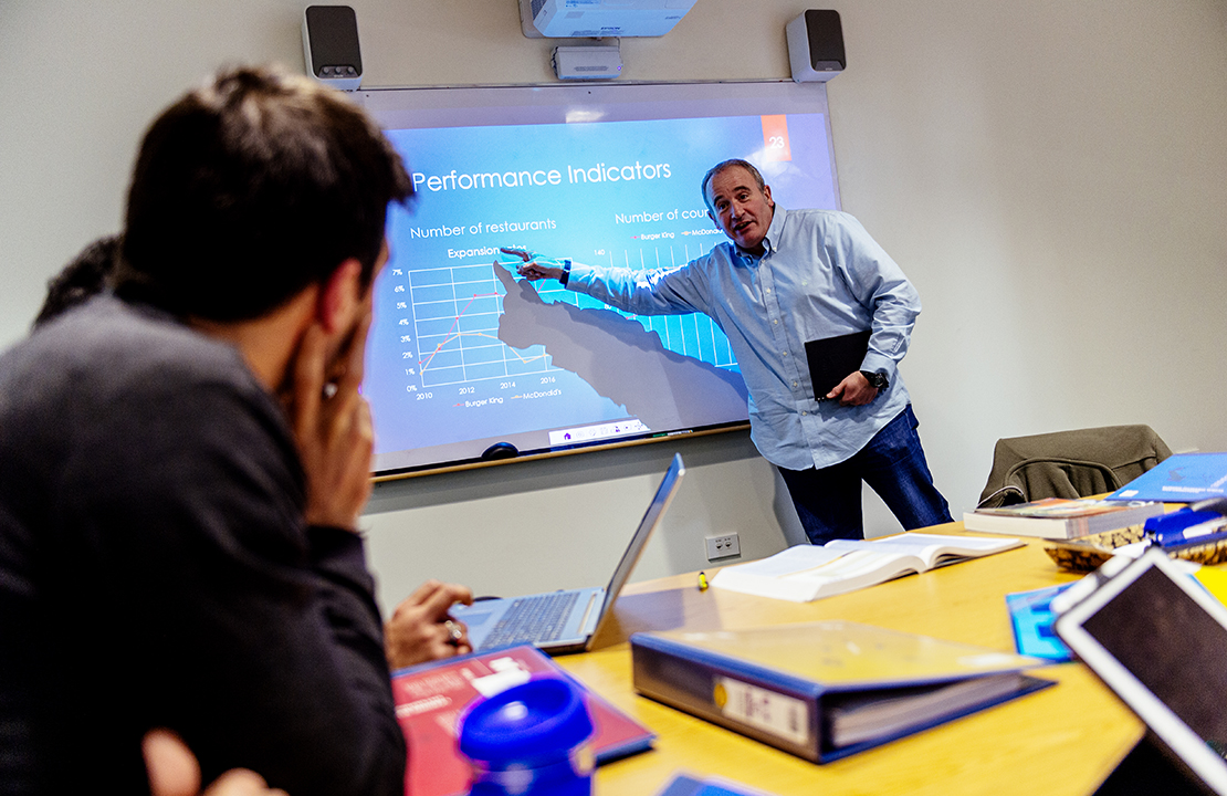 Students listening to lecturer's presentation