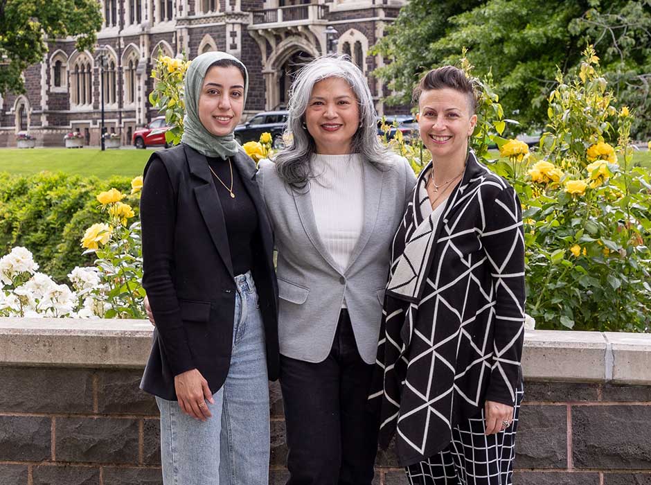 Three woman standing in front of the clocktower