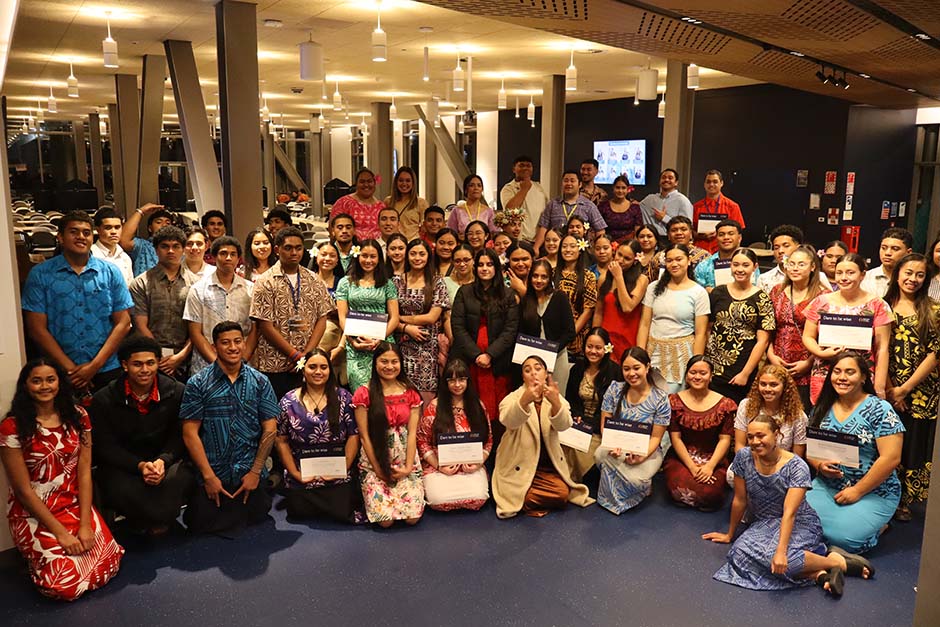 A large group of Pacific Island students in colourful clothing