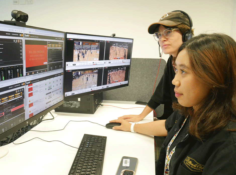 two women looking at a screen