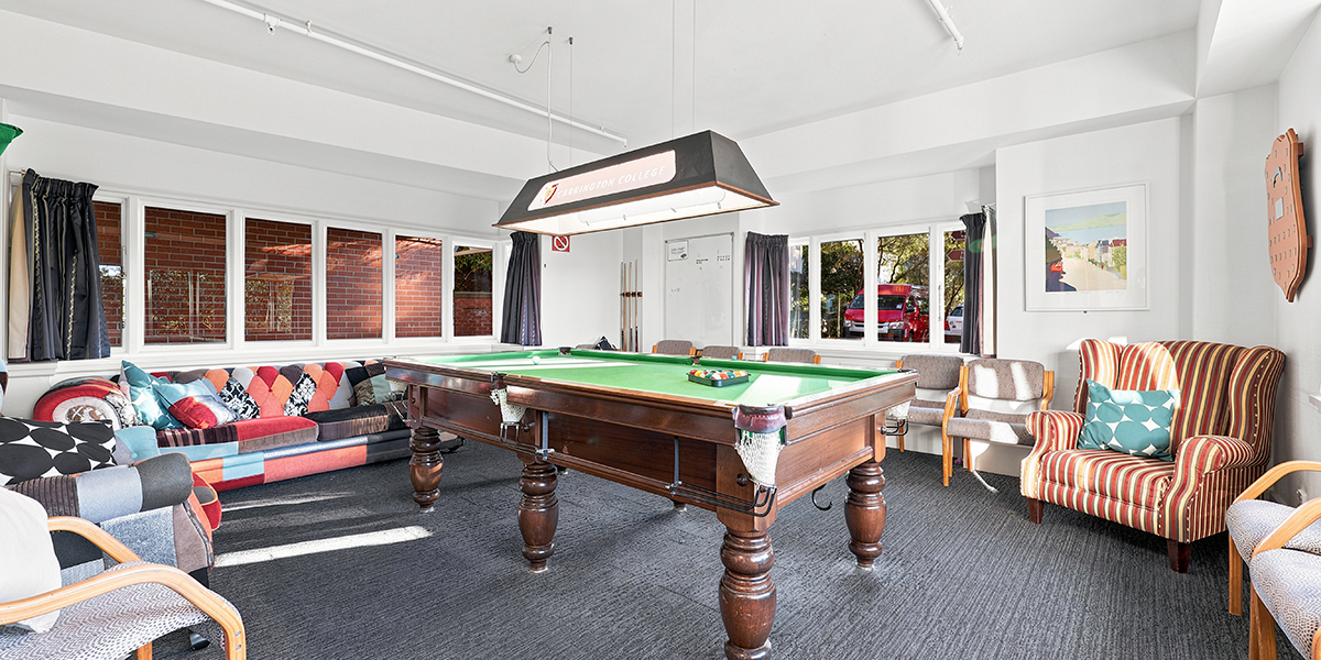 Common area with pool table and sofas