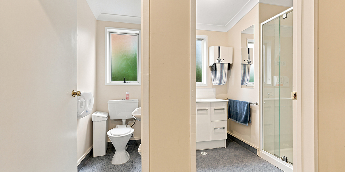 Bathroom facilities with separate cubicles for toilet and shower.