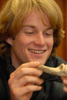 Callum Bruce holds a bone