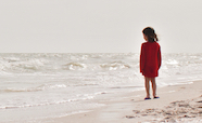 Lone child on a beach thumbnail