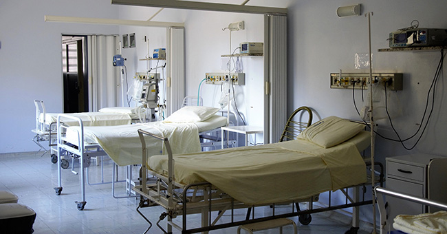Stock photo of a hospital room with three empty beds image