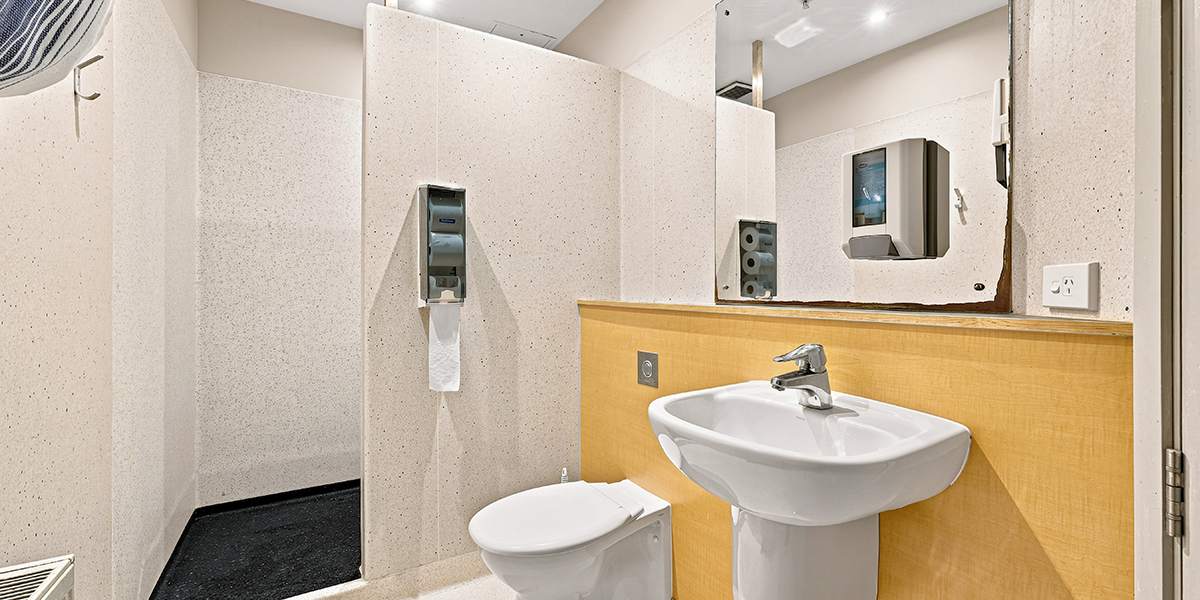 Bathroom with sink, shower, toilet and mirror