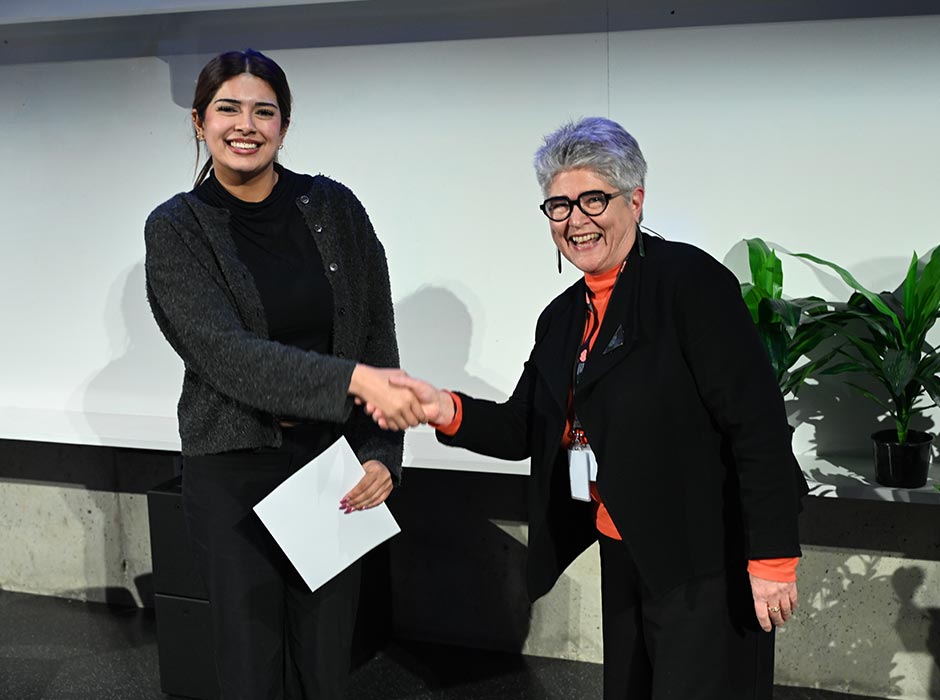 Three Minute Thesis (3MT) Wellington Heat winner Aparna Menon is congratulated by judge Emerita Professor Dawn Elder. 