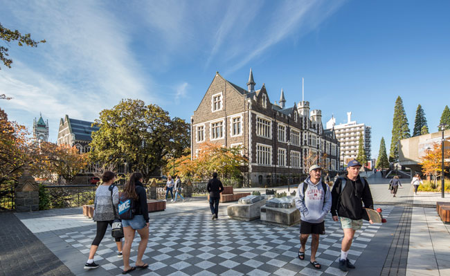 Students walking across Union Street Bridge on Dunedin Campus.