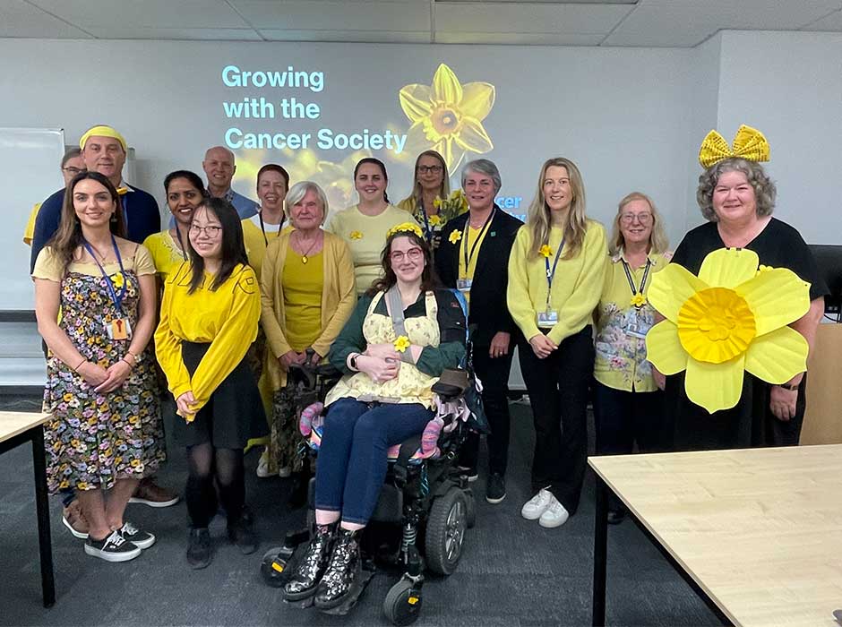 ā group of people dressed in yellow for daffodil day