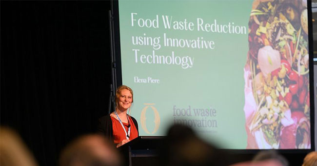 A woman presents at a conference