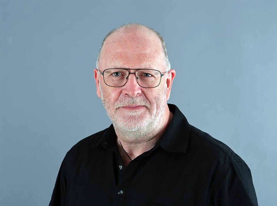 A headshot of Paul Kane.