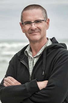 a man standing with his arms crossed
