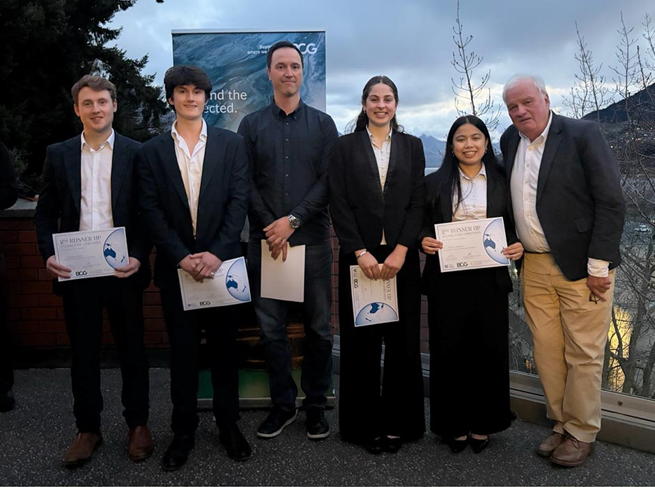 Four tauira holding certificates and two judges pose for a photo.