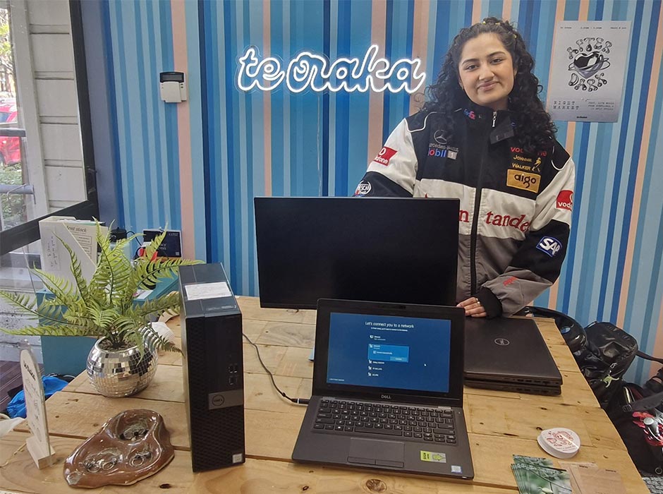 ITS Infrastructure Intern Shreya Das with some of the IT equipment available for purchase by students and staff at Te Oraka.