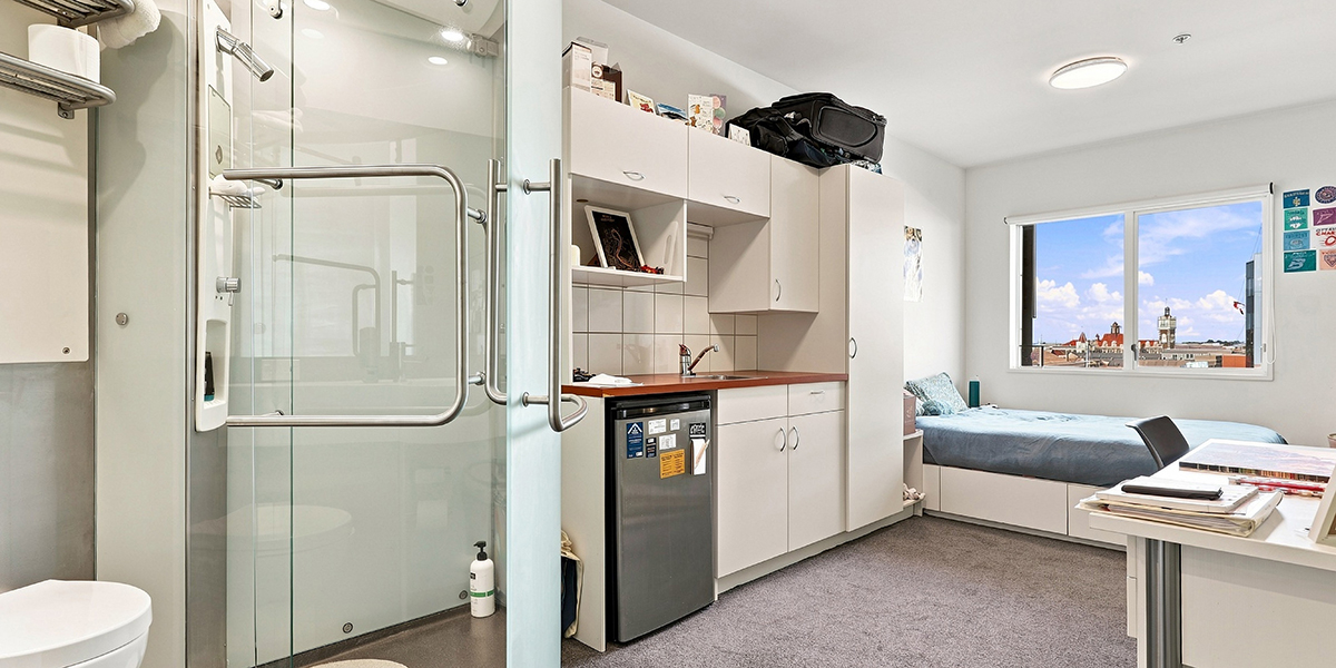 Bedroom with ensuite bathroom and small kitchenette