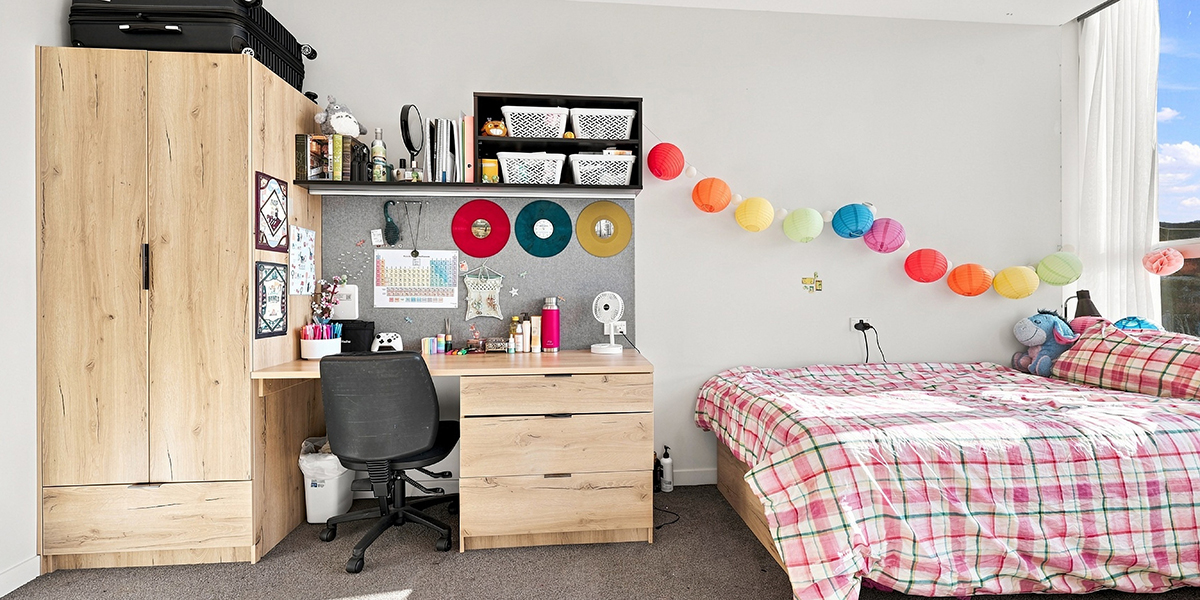 Student bedroom with wooden furniture