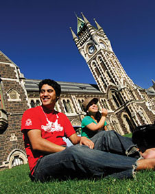 student sitting in front of clocktower