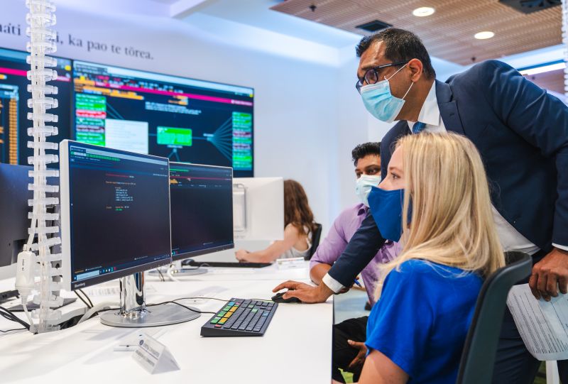 teacher and student at a computer