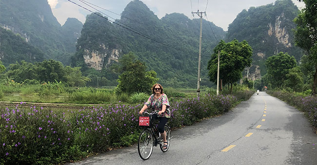 a woman riding a bike 