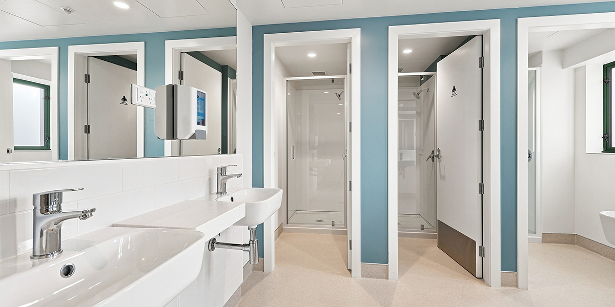 Shower facilities with sink and individual shower cubicles
