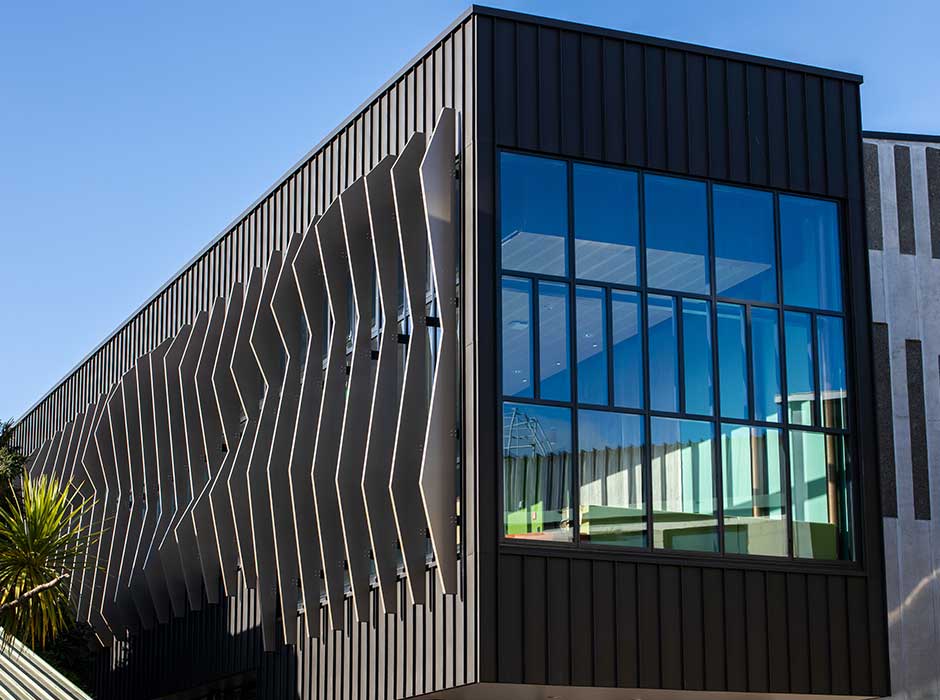 A black building with lots of glass