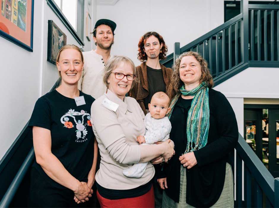 A group of people standing on a stairwell 