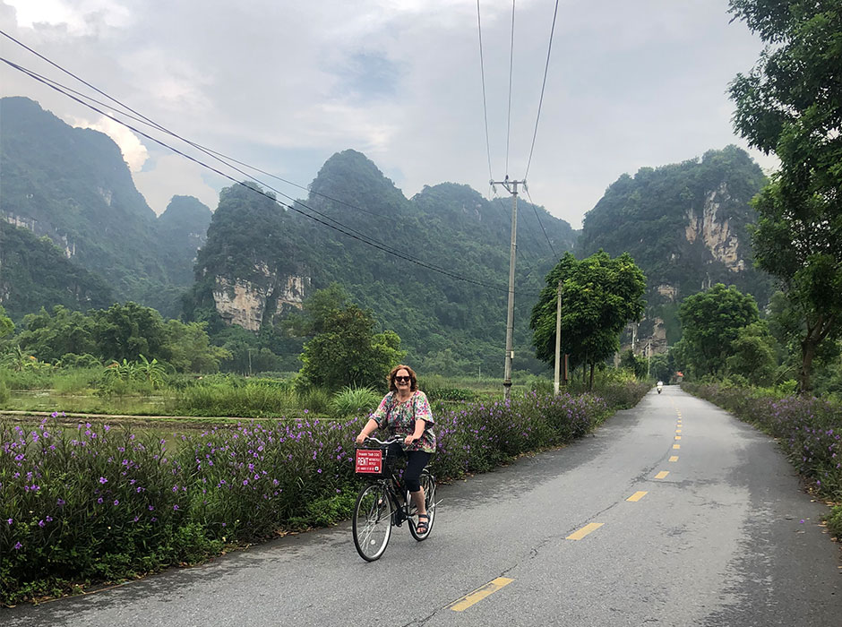 a woman riding a bike 