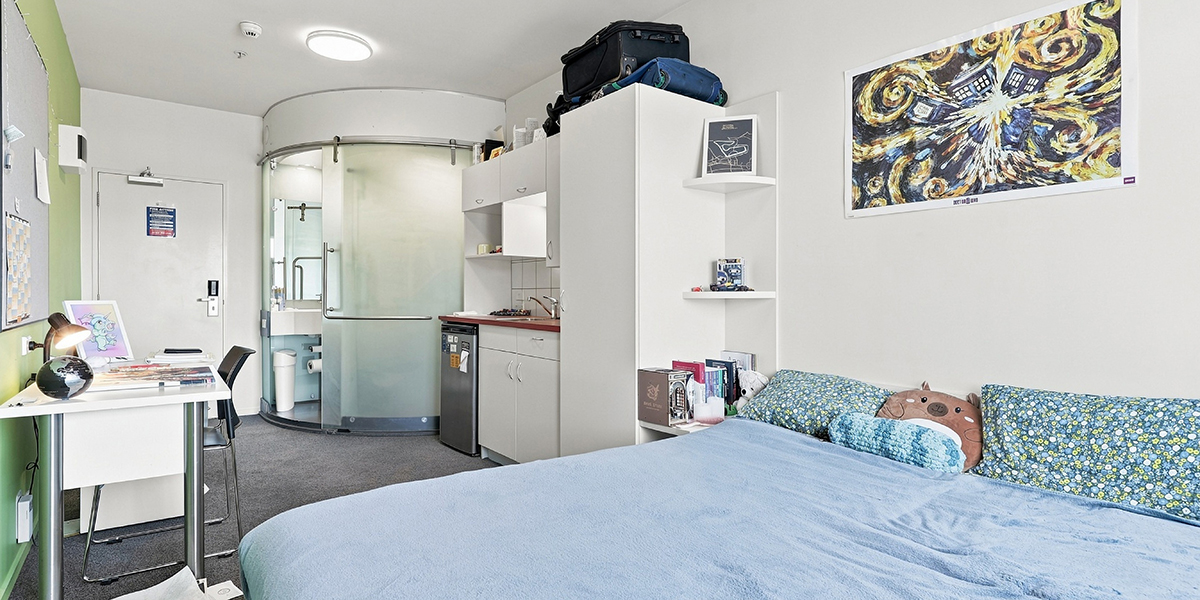 Student bedroom with double bed, desk and ensuite bathroom