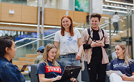 Five students sitting and chatting in the Otago Business School lobby image