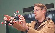 thumb_Ben Peters with molecular models