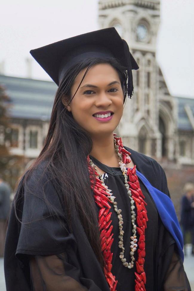 Jaye Moors in her graduation outfit outside the University clocktower