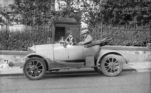 A 1920 photo of Professor Drennan sitting in his car outside First Church