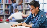 Student studying in the Caroline Freeman College Library thumbnail
