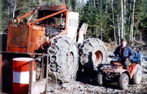 Skidder clearing drill pads in Red Lake, Ontario, Canada.