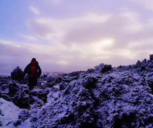 The first winter snow on an A'a Lava Field on Hekla, once believed to be the gateway to Hell by Europe and now two years overdue for its next eruption