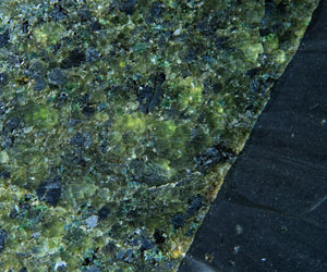 This basalt (right) has risen directly from the mantle plucking fragments of spinel peridotite (left) under the Auckland Islands. Image is ~ 5 cm wide