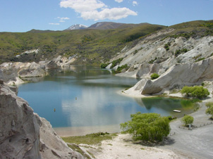 The Blue Lake alluvial gold mine, St Bathans, Central Otago. The Blue Lake Fault passes through this area, but is diffuse as it has caused shearing at several different rock boundaries. Gold was enriched near the boundary between the white quartz gravels (centre) and the greywacke basement that forms the hills to the right and in the background.