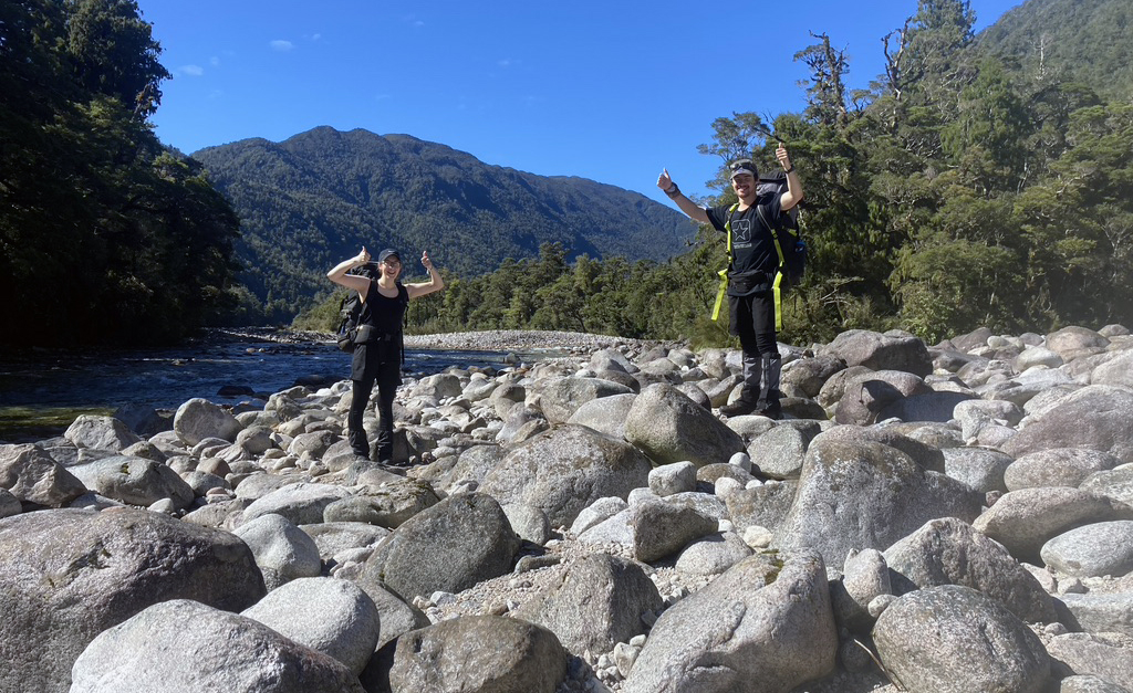 Nadine Cooper and Orion Marshall tramping up the Ohikanui River, Westland, in search of REE-rich minerals.