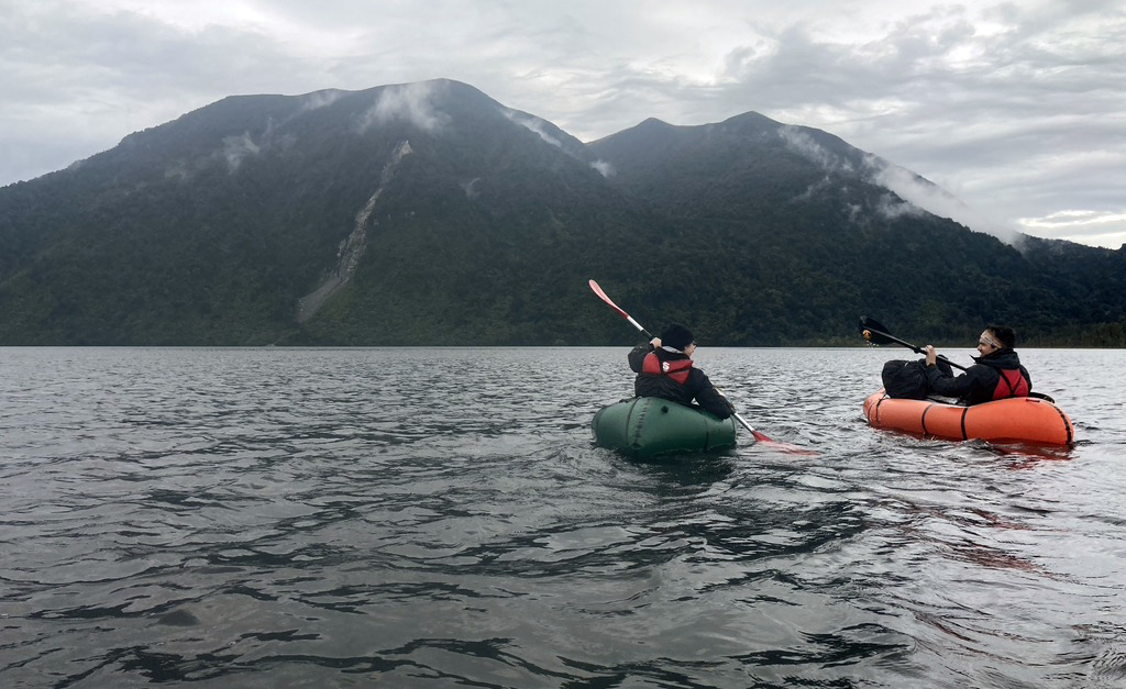 Students paddling across Lake Moana to look for mantle xenoliths on the flanks of Te Kinga