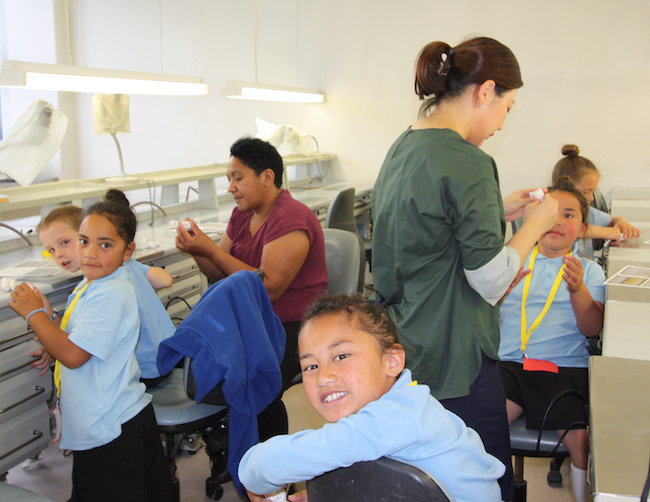 Children learning about oral health in a lab 650